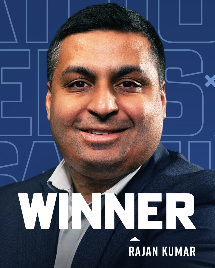 A man in a suit smiles at the camera with the word "WINNER" and the name "Rajan Kumar" displayed in bold text on a blue background.